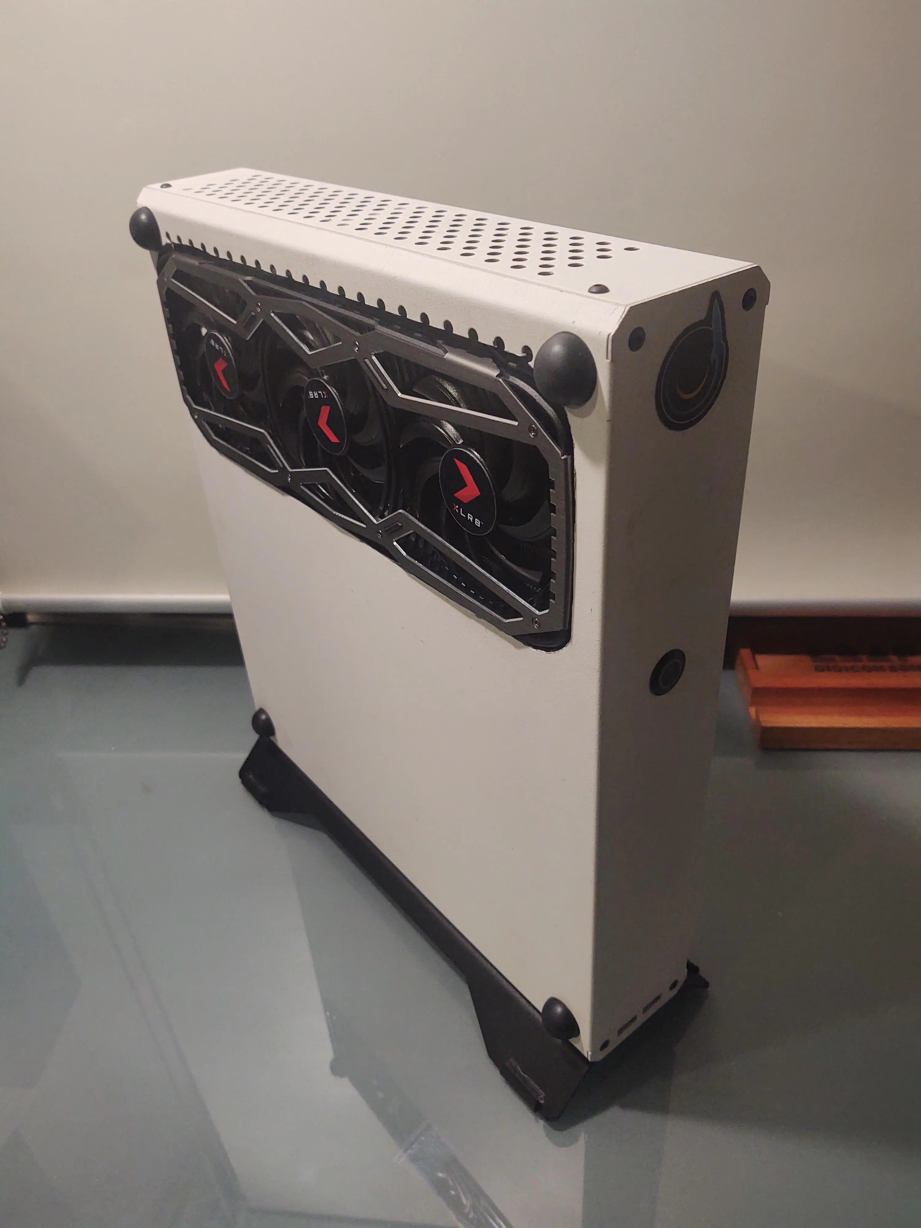 A personal computer in a Dr. Zaber Sentry PC case, modified by cutting a window out of its side so the graphics card peeks out like a hotrod car engine.