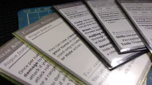 Spread of five home-made Dungeons & Dragons feature cards.