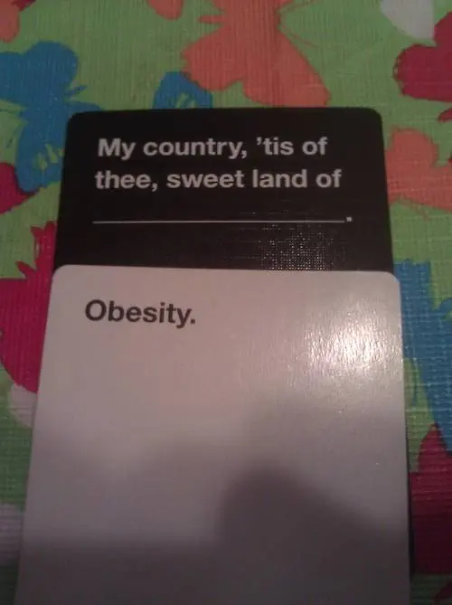 Cards Against Humanity combo. Black card: “My country, 'tis of thee, sweet land of (blank).” White card: “Obesity.”