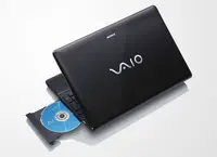 Product photo of the 15.5-inch Sony Vaio E Series laptop with its lid slightly open and DVD-ROM bay extended.